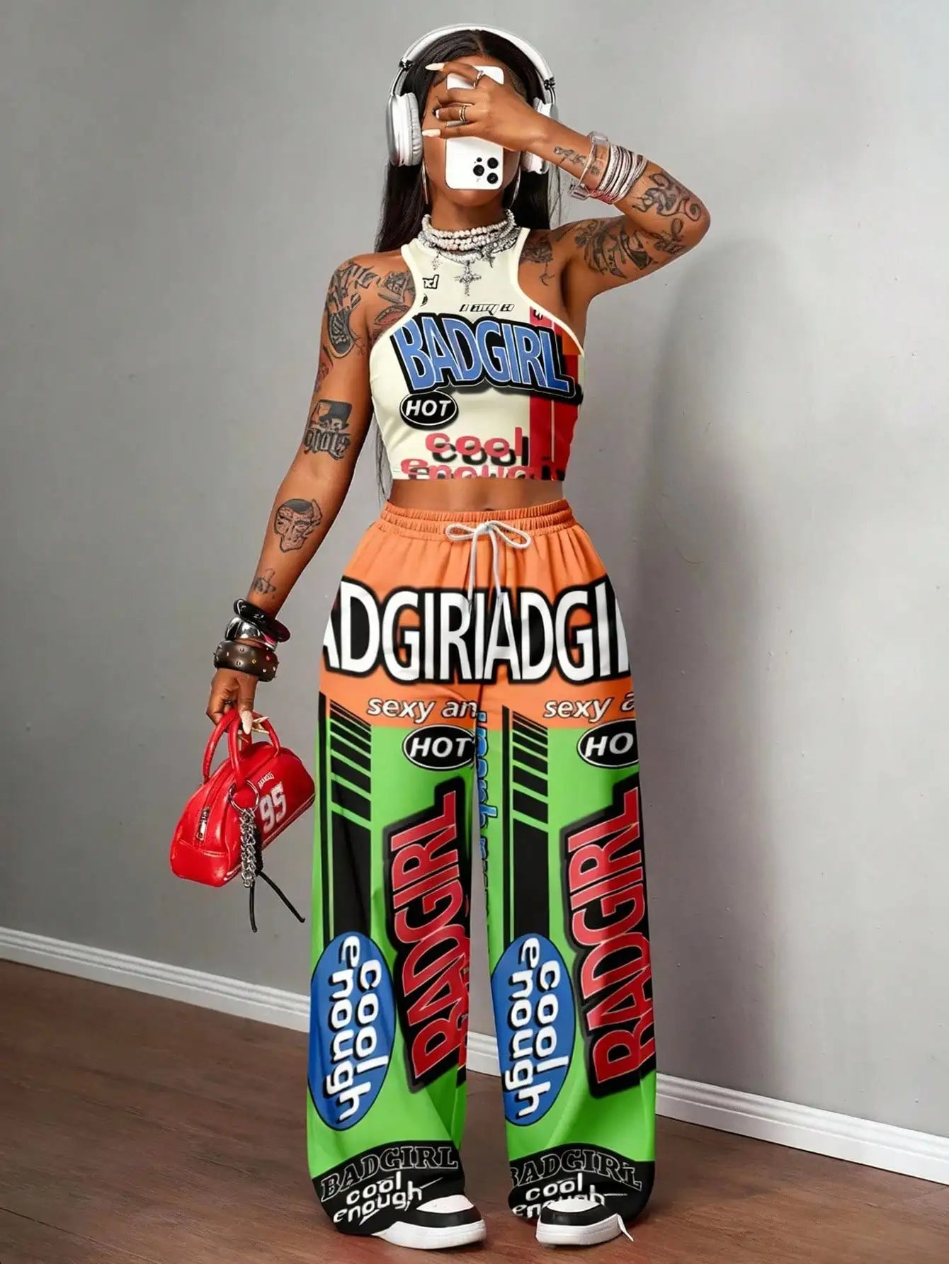 Graphic racerback crop top & wide leg pants set for streetwear.
