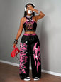 Graphic racerback crop top & wide leg pants set for streetwear.