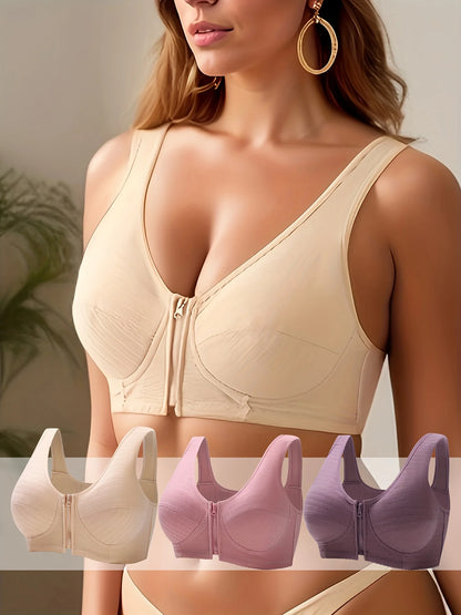 Three pieces of wireless, comfortable women's front-closure brassieres for women's lingerie and undergarments.