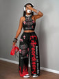 Graphic racerback crop top & wide leg pants set for streetwear.