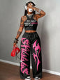 Graphic racerback crop top & wide leg pants set for streetwear.