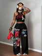 Graphic racerback crop top & wide leg pants set for streetwear.