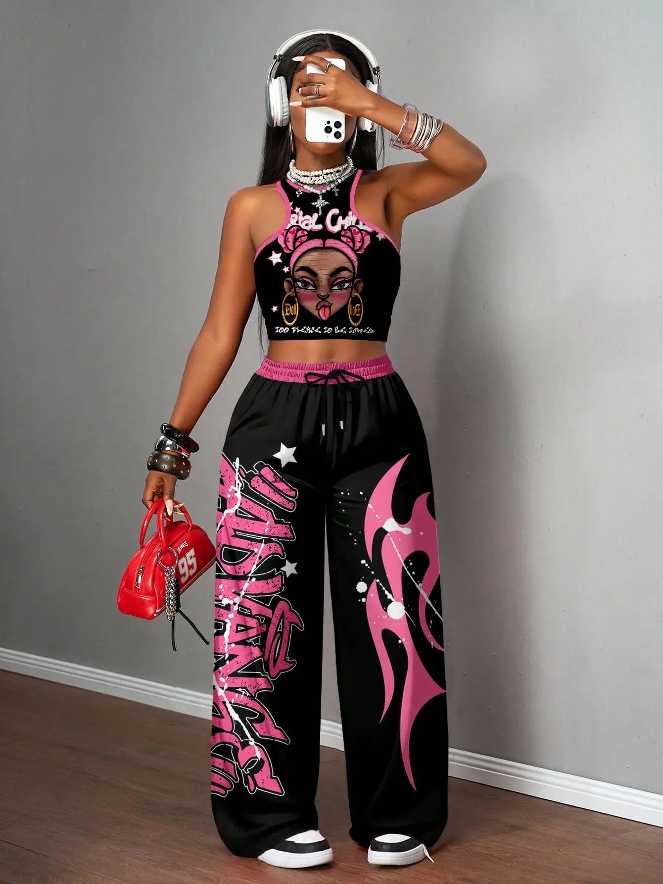 Graphic racerback crop top & wide leg pants set for streetwear.