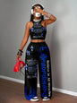 Graphic racerback crop top & wide leg pants set for streetwear.